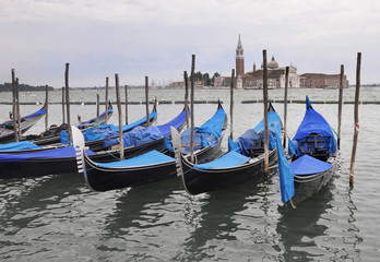 Fototapeta na wymiar Original blue gondolas in Venezia