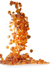 Slices of falling brown candy sugar