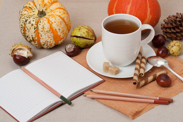Opened Notebook. Cup Of Hot Tea With Sweets. Natural Linen Table