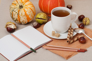 Opened Notebook. Cup Of Hot Tea With Sweets. Natural Linen Table