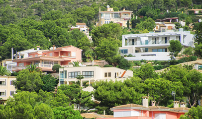 Houses in the green mountain hills.