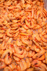 Pile of raw shrimps in fish market.