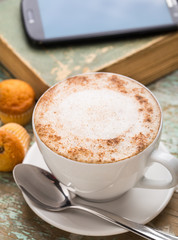Cappuccino coffee with muffins