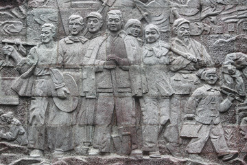 relief picture of chinese workers on stone