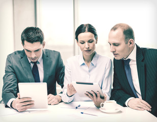 business team with tablet pc having discussion