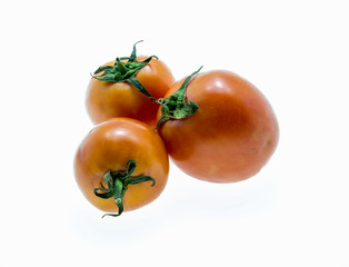 tomatoes with green leaves isolated on white background