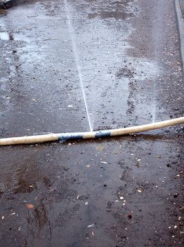 Water fountains are beaten up from damaged fire hose