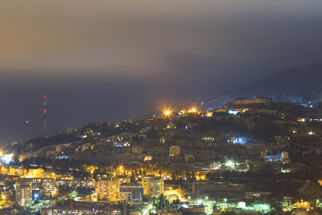 City under mountain at night