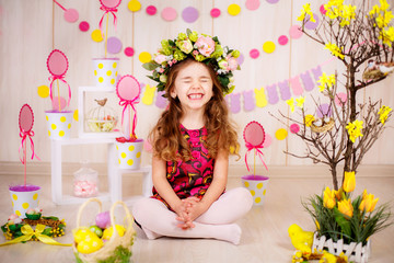 Easter concept. Beautiful girl in the room with decorations