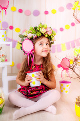 Easter concept. Beautiful girl in the room with decorations