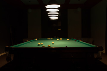 Pool Table in Dimly Lit Pool Hall