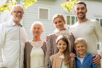 happy family in front of house outdoors