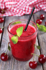 Fresh cold cherry cocktail with mint and lemon