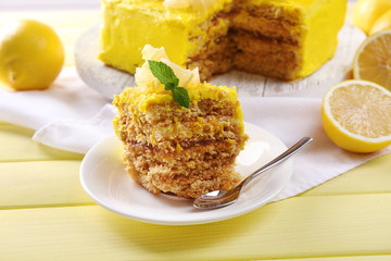 Tasty lemon dessert on wooden table