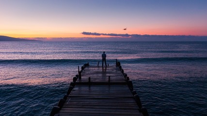 Fototapeta na wymiar Black sea at dawn with pier