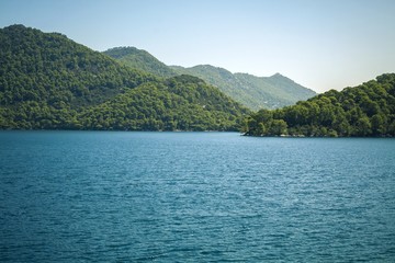 Turquoise sea and green mountain