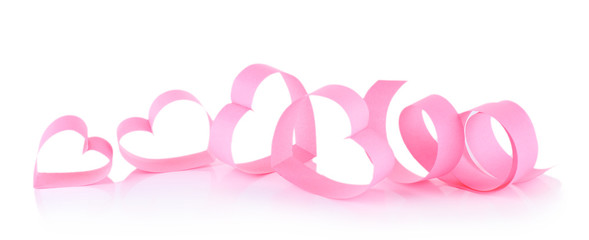 Heart shaped pink paper ribbon isolated on white