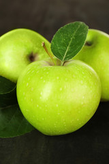 Ripe green apples on wooden background