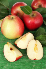 Ripe apples on wooden background