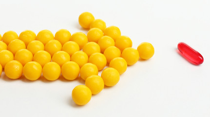 Individuality concept. Pills isolated on white