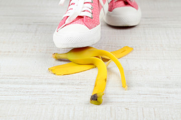 Shoe to slip on banana peel and have an accident © Africa Studio