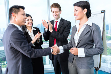 Business team applause in meeting