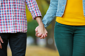 Loving couple holding hands outdoors