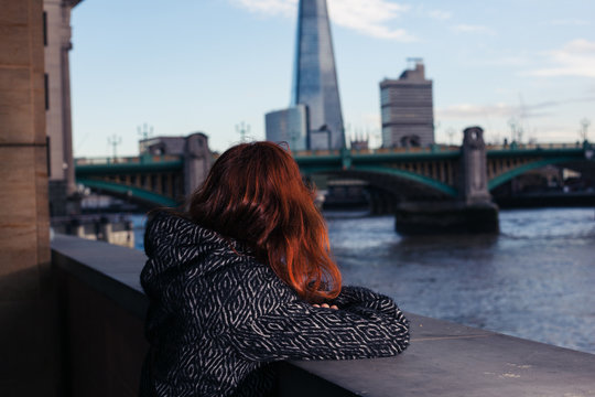 Woman looking at river Thames