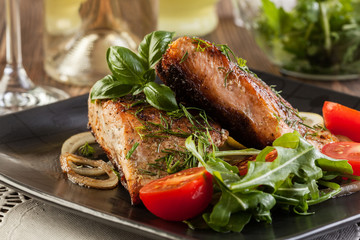 Fried salmon steak with vegetables