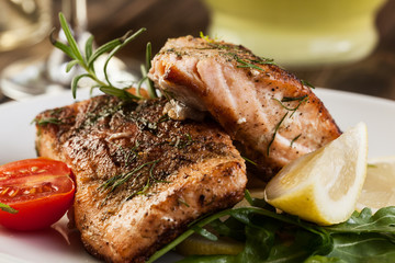 Fried salmon steak with vegetables