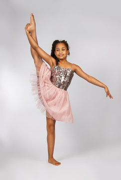 Image of flexible little girl doing vertical split