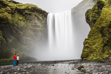 Couple Looking at Waterfall in Iceland