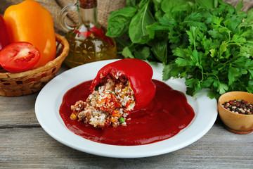 Prepared stuffed pepper with tomato sauce