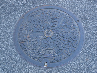 Manhole drain cover on the street at Nara, Japan