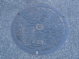 Manhole drain cover on the street at Nara, Japan