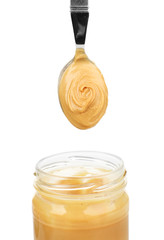 Creamy peanut butter in jar, isolated on white