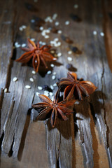 Star anise on dark wooden background, close-up