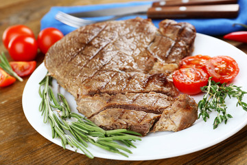 Delicious grilled meat on table