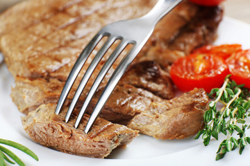 Delicious grilled meat on table, close-up