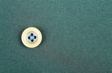 Button on cloth, close up