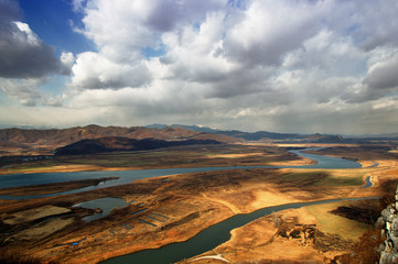 view of a valley over hills