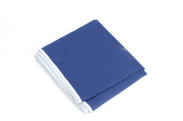 Pile of different fabrics isolated on white