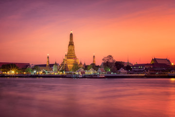Wat arun main pagoda in sunset Bangkok Thailand