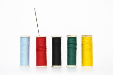 Colorful old style threads on white background