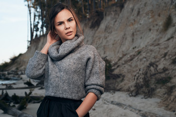 brunette on sea coast in autumn