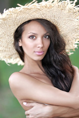 Naklejka premium portrait of a beautiful young girl in summer