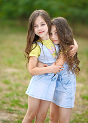 Fototapeta na wymiar Portrait of two little girls twins