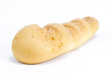 Golden Brown Loaf of French Baguette Bread over white.