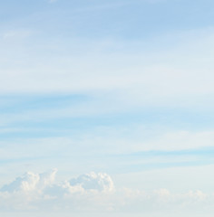 fluffy clouds in the blue sky