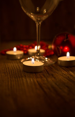candles burning in the dark on the background of Christmas decor